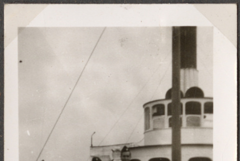 Two men standing by wheelhouse on ship (ddr-densho-466-79)