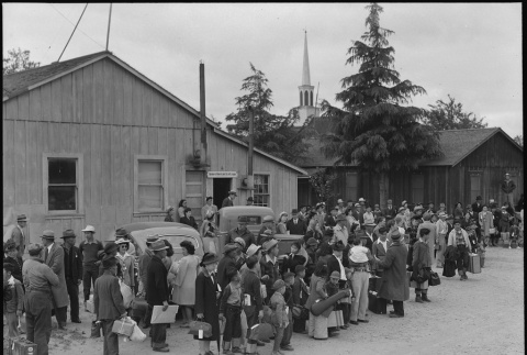Japanese American families waiting for bus (ddr-densho-151-201)