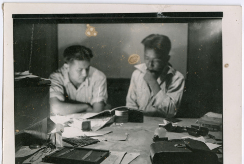 Two men at a desk (ddr-densho-377-1649)