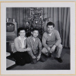 Family in front of Christmas tree (ddr-densho-522-533)