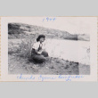 Woman kneeling next to pond (ddr-densho-464-24)