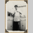 Gary Kikawa mixing at a pharmacy counter (ddr-densho-542-501)
