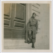 Soldier standing on street next to door (ddr-densho-368-111)