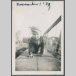 Photo of a toddler in a jacket and hat crawling (ddr-densho-483-705)