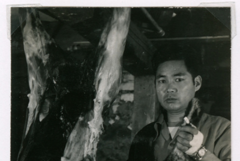 Takeo Isoshima with a deer carcass (ddr-densho-477-239)
