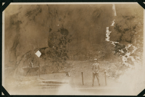 Man in front of waterfall (ddr-densho-359-523)