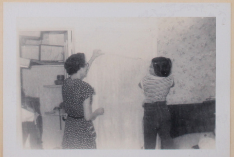 Betty and Mary Alice handing curtain (ddr-densho-462-265)