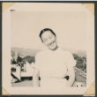 Woman smiling on a rooftop (ddr-densho-433-777)