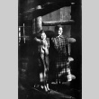 Tomoye (Nozawa) Takahashi and unknown woman standing in doorway of log house (ddr-densho-426-2021)