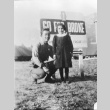 Adult and child in front of 