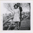 Couple on a bridge in Manzanar's garden (ddr-manz-10-115)