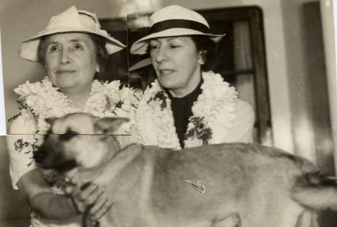 Polly Thomson and Helen Keller petting her dog (ddr-njpa-1-760)