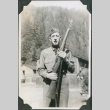 Man holding rifle (ddr-ajah-2-338)