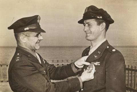 Major General Jimmy Doolittle pinning Major Wade C. Walles with the Distinguished Flying Cross (ddr-njpa-1-187)