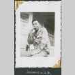 Man sitting on porch eating (ddr-densho-434-154)