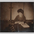 A girl reading (ddr-densho-278-214)