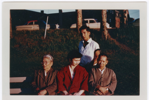 Photo of four people in a park (ddr-densho-483-36)