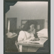 Woman sitting at a desk (ddr-densho-463-6)