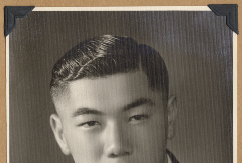 Portrait of a man with lapel pins (ddr-densho-542-259)