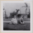 Susan and Leslie Shiomi sitting on lawn (ddr-densho-522-365)