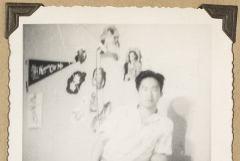 Gary Kikawa in a bedroom (ddr-densho-542-507)