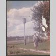 Woman standing on path in yard (ddr-densho-523-320)