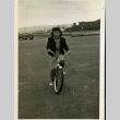 Tazu Kawamoto on a bike (ddr-csujad-11-180)