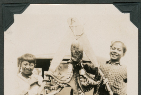 Photo of two boys with an octopus (ddr-densho-483-385)