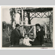 Photograph of Lillian and Harry Matsumoto with an infant at the Children's Village park in Manzanar (ddr-csujad-47-160)