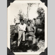 Two men sitting on rocks (ddr-densho-587-24)