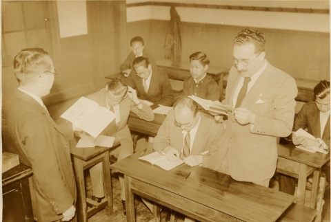 Men reading in a classroom (ddr-njpa-1-1783)