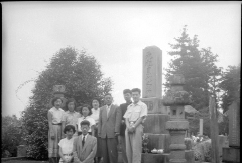Group standing by stones in cemetery (ddr-densho-426-2472)