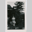 Girl on rock with kitten (ddr-densho-329-795)