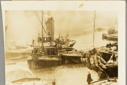 Men loading cargo at a dock (ddr-njpa-13-600)