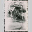 Two Men pose under trellis arbor (ddr-densho-368-560)