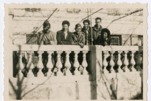 Group of soldiers and women along railing (ddr-densho-368-229)