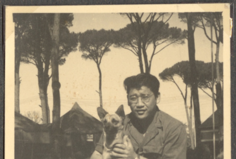 Man holding dog (ddr-densho-466-40)