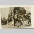Firemen surveying damage to a bombed building (ddr-njpa-13-1006)