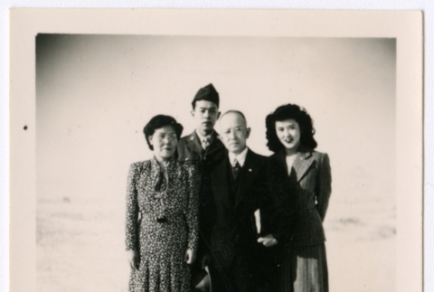 Four Japanese Americans in an open field (ddr-densho-362-14)
