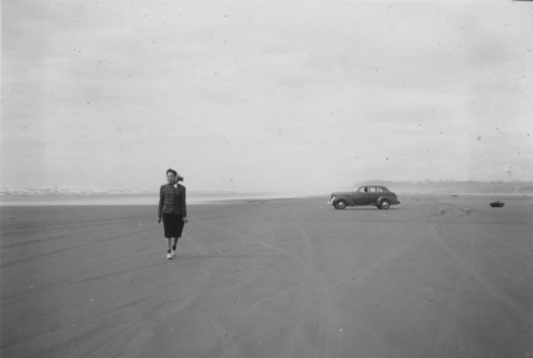 Japanese American woman on beach (ddr-densho-128-124)