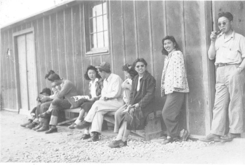 Japanese Americans in front of barracks (ddr-densho-157-41)