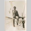Man seated on railing of S.S. Taiyo Maru (ddr-densho-426-1545)
