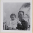 Man holding Leslie Shiomi (ddr-densho-522-400)