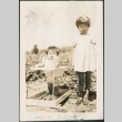 Lois Sakahara and Arlene Sakahara standing in a farm field (ddr-densho-316-76)