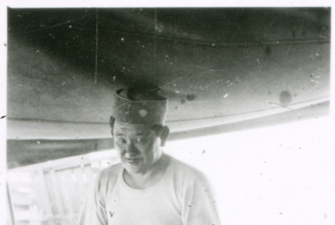 Soldier at table with clock (ddr-densho-1007-760)