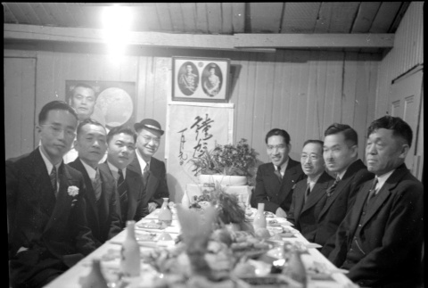Group of men around banquet table (ddr-densho-426-2153)