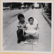 Susan Shiomi in bouncy chair with William Shiomi (ddr-densho-522-154)