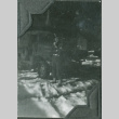 Man standing next to truck in snow (ddr-ajah-2-372)