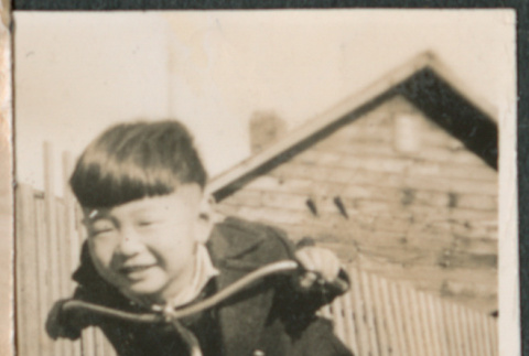 Boy on tricycle (ddr-densho-523-107)