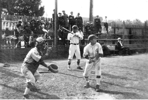 Three men in baseball uniforms at home plate (ddr-ajah-5-72)